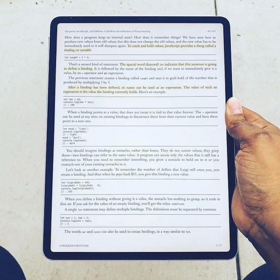 A photo of an iPad Pro 2018 model with a book opened in MapleRead app